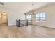 Bright living room with hardwood floors and large windows overlooking the neighborhood at 8926 S Rome Ct, Aurora, CO 80016