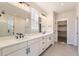 Bright bathroom features dual vanities and lots of storage space at 8926 S Rome Ct, Aurora, CO 80016