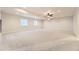 Spacious recreation room with plush carpeting and recessed lighting, ideal for entertaining and relaxation at 8926 S Rome Ct, Aurora, CO 80016