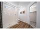 Bright bathroom with walk-in shower and a separate room for toilet and closet access at 22023 E 38Th Pl, Aurora, CO 80019