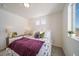 Comfortable bedroom with bright light and floral details creates a relaxing sleep atmosphere at 22023 E 38Th Pl, Aurora, CO 80019