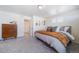 Comfortable bedroom with neutral decor, a dresser, and soft carpet at 22023 E 38Th Pl, Aurora, CO 80019