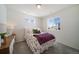 Charming bedroom with a floral bedspread, ample natural light, and cozy ambiance at 22023 E 38Th Pl, Aurora, CO 80019