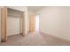 Basement bedroom featuring neutral walls, carpet floors, and a closet with a folding door at 6892 Juniper Ct, Arvada, CO 80007