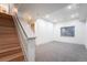 Finished basement with new carpet, recessed lighting, and easy access to a nearby staircase at 6892 Juniper Ct, Arvada, CO 80007