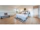 Cozy bedroom featuring natural light, hardwood floors, and a stylish rug at 6892 Juniper Ct, Arvada, CO 80007