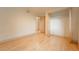 Bedroom with hardwood floors, a closet, and views at 6892 Juniper Ct, Arvada, CO 80007