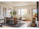 Bright dining area with a large table and plenty of natural light at 6892 Juniper Ct, Arvada, CO 80007