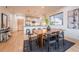 Open-concept living space with a dining area that connects to the modern kitchen, creating a spacious feel at 6892 Juniper Ct, Arvada, CO 80007