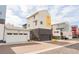 Exterior view of modern multi-story homes with attached garages and contemporary designs at 6892 Juniper Ct, Arvada, CO 80007