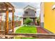 Beautifully landscaped front yard with green lawn and modern fence at 6892 Juniper Ct, Arvada, CO 80007