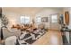 Inviting living room with hardwood floors, vaulted ceilings and contemporary decor at 6892 Juniper Ct, Arvada, CO 80007