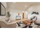 Comfortable living room with hardwood floors and abundant light at 6892 Juniper Ct, Arvada, CO 80007