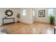 Versatile living space with hardwood floors, natural light, and ample room for customization and decor at 6892 Juniper Ct, Arvada, CO 80007
