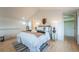 Inviting main bedroom with hardwood floors, a comfortable bed, and tasteful decor with ample space at 6892 Juniper Ct, Arvada, CO 80007