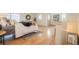 Stylish primary bedroom with hardwood floors, a decorative mirror, and a cozy, inviting atmosphere at 6892 Juniper Ct, Arvada, CO 80007