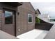 Private patio area features door to the home at 6892 Juniper Ct, Arvada, CO 80007
