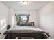 Bright bedroom with a queen-size bed and window at 7995 E Mississippi Ave # J1, Denver, CO 80247