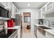 Updated kitchen featuring stainless steel appliances and white cabinetry at 7995 E Mississippi Ave # J1, Denver, CO 80247