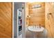 Powder room with pedestal sink and wood-paneled walls at 7995 E Mississippi Ave # J1, Denver, CO 80247