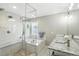 Modern bathroom featuring a glass-enclosed shower, soaking tub, and granite countertop vanity at 10601 Chadsworth Ln, Highlands Ranch, CO 80126