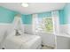 Charming bedroom with a white canopy bed, beadboard paneling, and a bright, airy feel at 10601 Chadsworth Ln, Highlands Ranch, CO 80126