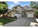 Charming two-story home featuring a three-car garage, tasteful landscaping, and a welcoming façade at 10601 Chadsworth Ln, Highlands Ranch, CO 80126