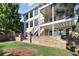 Back of house with a multilevel patio and stone retaining wall at 10601 Chadsworth Ln, Highlands Ranch, CO 80126