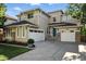 Charming two-story home featuring a three-car garage, tasteful landscaping, and a welcoming façade at 10601 Chadsworth Ln, Highlands Ranch, CO 80126