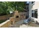 Inviting outdoor fireplace with stone surround and seating area at 10601 Chadsworth Ln, Highlands Ranch, CO 80126