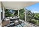Relaxing covered porch featuring comfortable seating and beautiful views of the surrounding landscape at 10601 Chadsworth Ln, Highlands Ranch, CO 80126