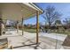 Expansive backyard with a covered patio, lush lawn, and mature trees, perfect for outdoor living at 2674 S Krameria St, Denver, CO 80222
