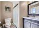 Updated bathroom features a tiled shower, modern vanity, and neutral color scheme at 2674 S Krameria St, Denver, CO 80222