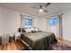 Bright bedroom features hardwood floors, large dresser, and ceiling fan at 2674 S Krameria St, Denver, CO 80222