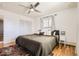 Bright bedroom with hardwood floors, ceiling fan, and neutral tones offering a calm space at 2674 S Krameria St, Denver, CO 80222