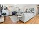Bright living room with a comfortable sectional sofa, stylish decor, and hardwood floors, creating a cozy atmosphere at 2674 S Krameria St, Denver, CO 80222