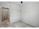 An empty bedroom with a closet features neutral carpet and white walls, creating a serene space at 1881 S Dunkirk St # 106, Aurora, CO 80017