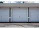 A row of white garages each numbered, show a safe place to park your car at 1881 S Dunkirk St # 106, Aurora, CO 80017