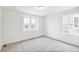Bright bedroom with carpeted floors and two windows offering natural light at 20724 E 57Th Ave, Aurora, CO 80019