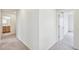 Hallway with carpet flooring branches off to different rooms at 20724 E 57Th Ave, Aurora, CO 80019