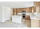 Spacious kitchen with stainless appliances, ample cabinetry, a kitchen island, and modern countertops at 20724 E 57Th Ave, Aurora, CO 80019