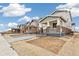 Exterior street view of the new construction houses featuring stone accents, covered porches and newly landscaped yards at 20724 E 57Th Ave, Aurora, CO 80019