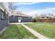 Backyard with a lush lawn, a patio area, and a fenced perimeter at 10752 Blue Jay Ln, Northglenn, CO 80233