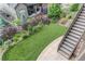 Professionally landscaped backyard with artificial grass and privacy fence at 8107 Arapahoe Peak St, Littleton, CO 80125