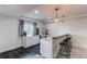 Basement bar area with sleek countertops, modern seating, and a beverage fridge, perfect for entertaining guests at 8107 Arapahoe Peak St, Littleton, CO 80125