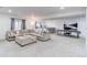 Spacious finished basement with a comfortable seating area, a bar, and a ping pong table for entertainment at 8107 Arapahoe Peak St, Littleton, CO 80125
