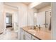 Bathroom featuring a double vanity and separate toilet/shower room at 8107 Arapahoe Peak St, Littleton, CO 80125