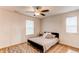 Bedroom with ceiling fan and natural light at 8107 Arapahoe Peak St, Littleton, CO 80125
