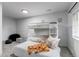 Bright bedroom featuring a bunk bed and neutral decor creating a cozy and inviting space for relaxation at 8107 Arapahoe Peak St, Littleton, CO 80125