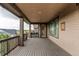 Covered deck boasts wood-like flooring, neighborhood views, and recessed lighting at 8107 Arapahoe Peak St, Littleton, CO 80125